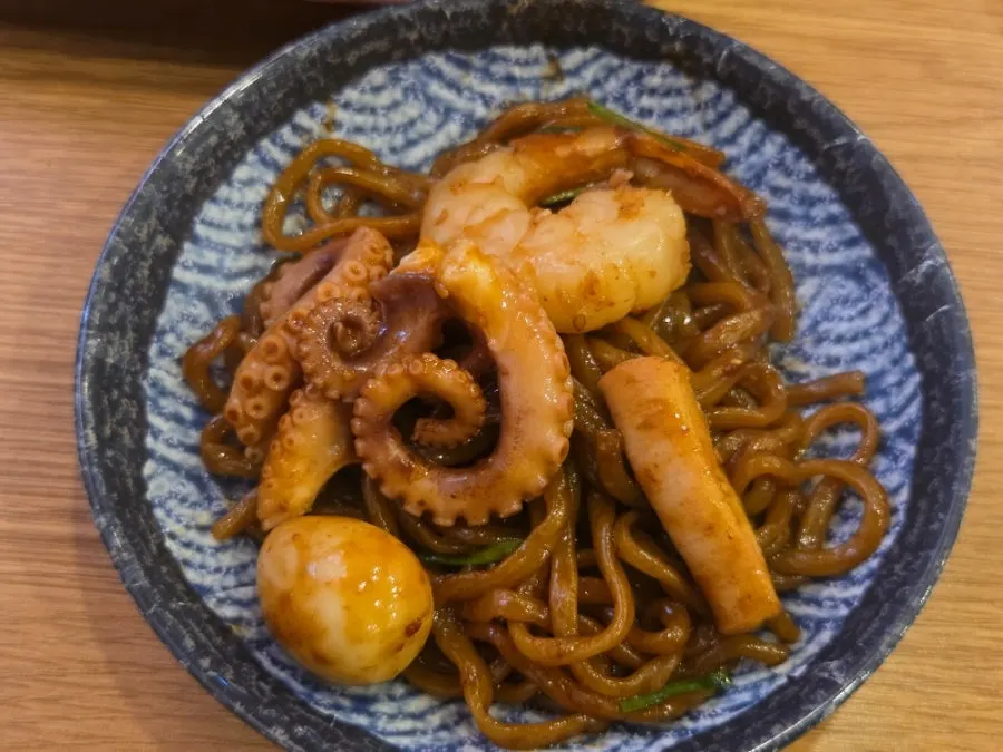 Close-up of the jjajang with added chili powder