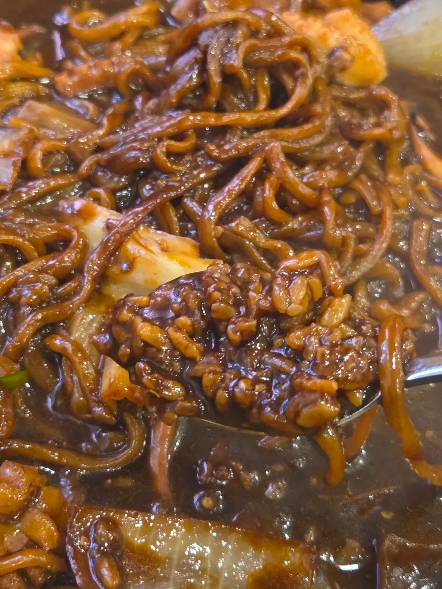 Crispy nurungji revealed beneath the jjajang noodles