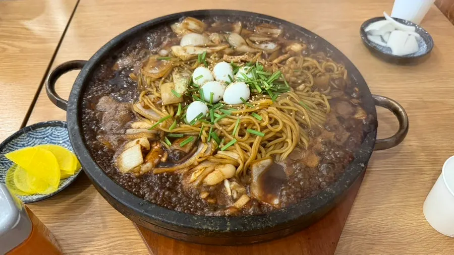 Stone-plate jajang served on a hot stone