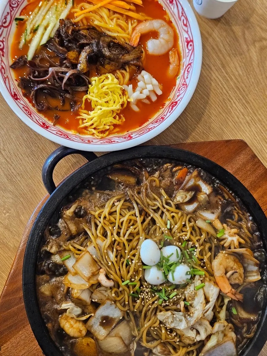 Table spread with the nurungji stone-plate jajang set and cold jjamppong