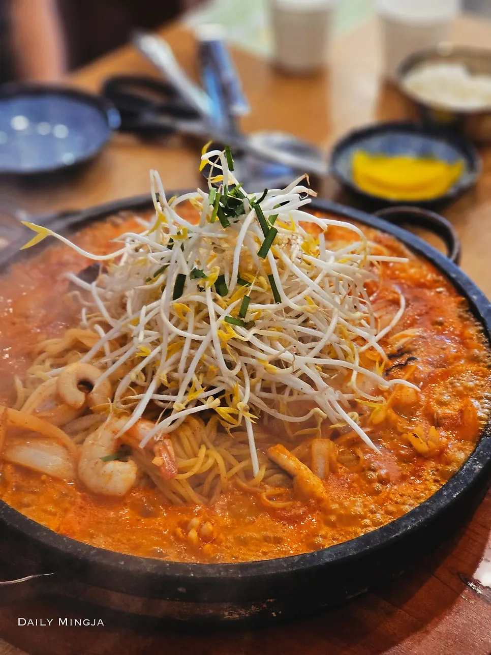 Large stone-plate jjamppong piled with whole squid, shrimp and mussels