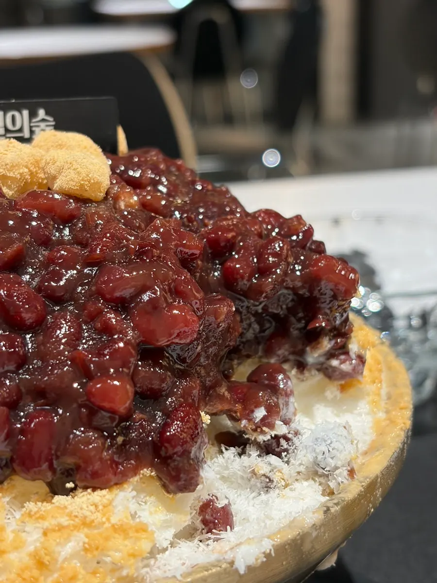 Patbingsu served with a small side plate and a large spoon
