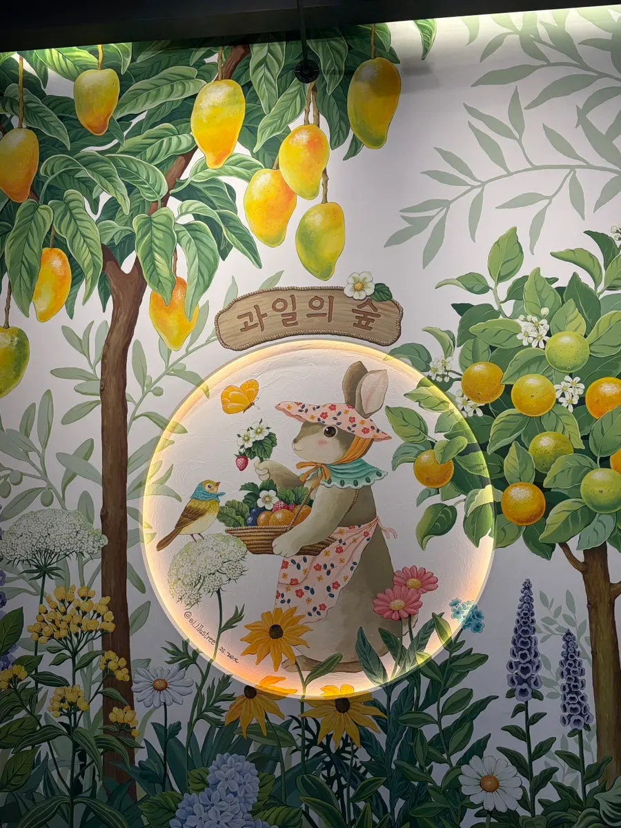 Hand-painted photo zone on the wall at Fruit Forest