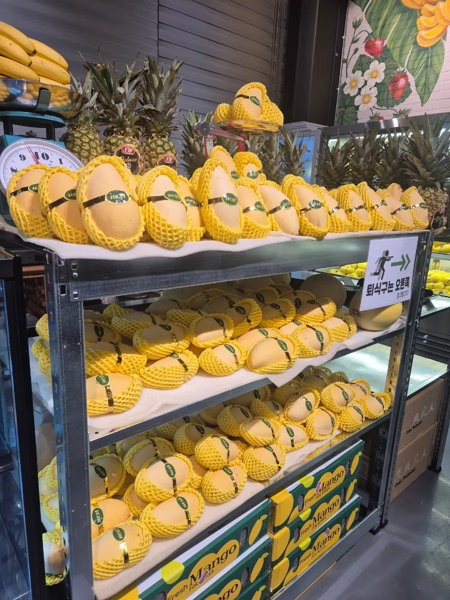 Mangoes displayed ripening in the store