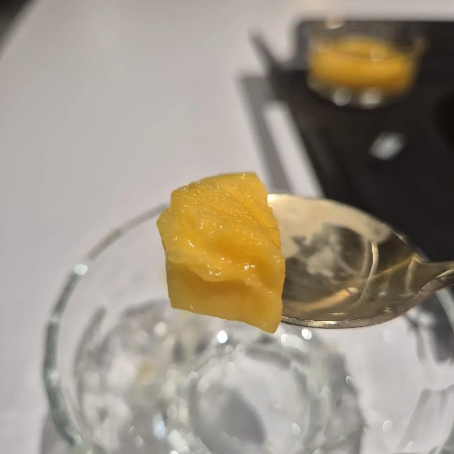 A spoonful of mango scooped up
