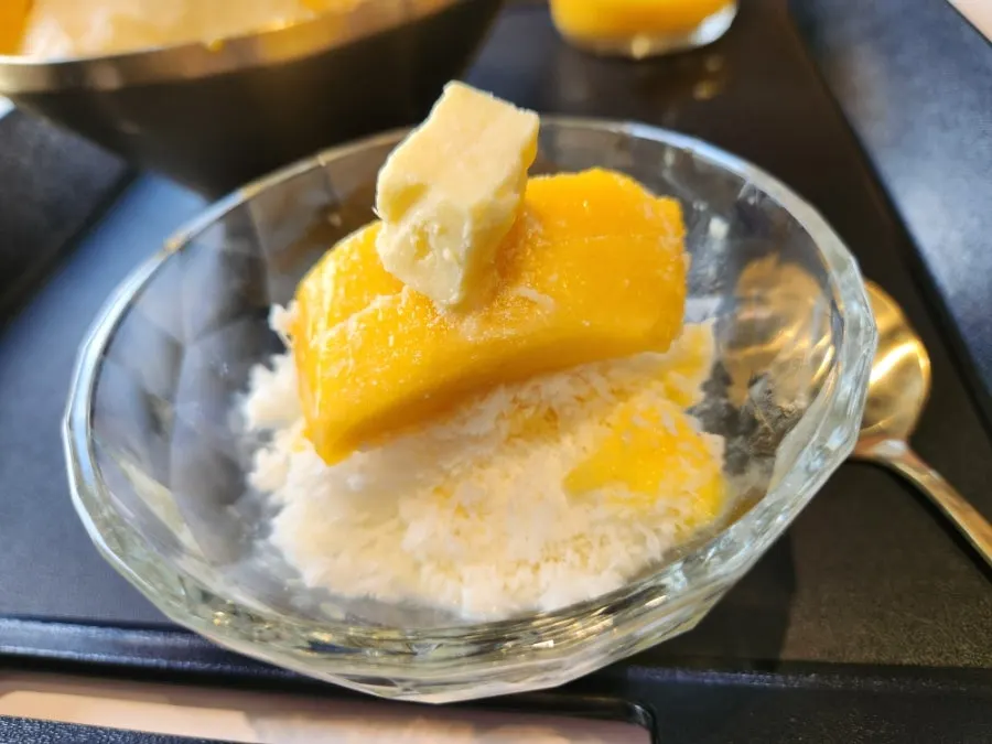 Close-up of fresh mango bingsu over snow ice