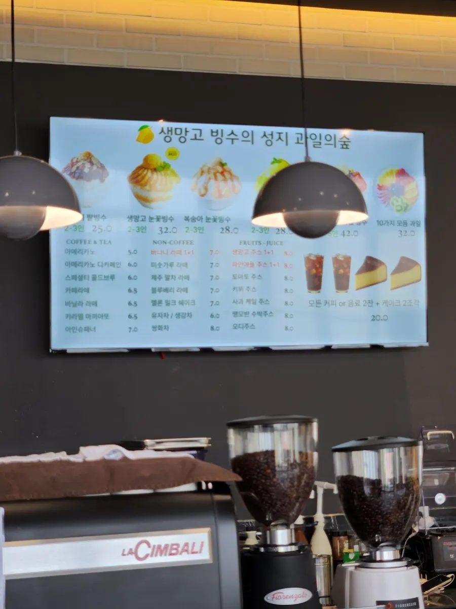 A bowl of fresh mango snow bingsu on the table