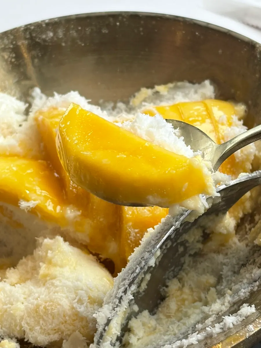Snow bingsu with mango purée poured over it