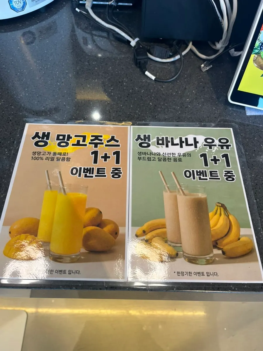 Spoonful of peach bingsu being scooped