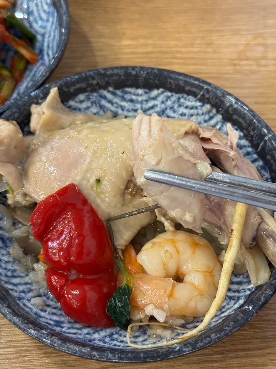 Close-up of tender, softly boiled chicken leg meat