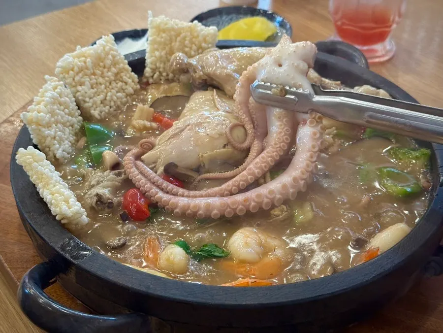 Stone-plate samgye seafood nurungji tang loaded with seafood
