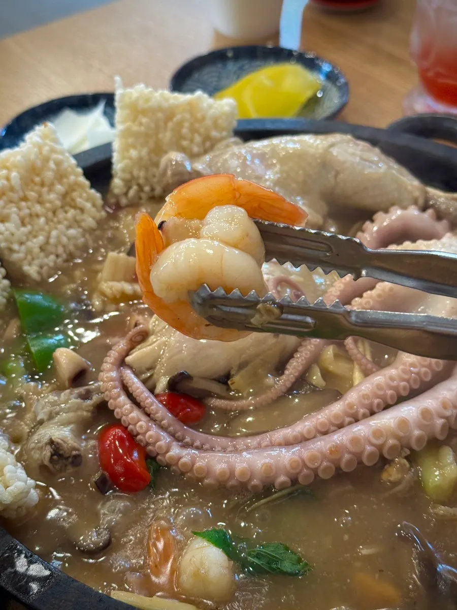 Chewy octopus lifted out of the broth