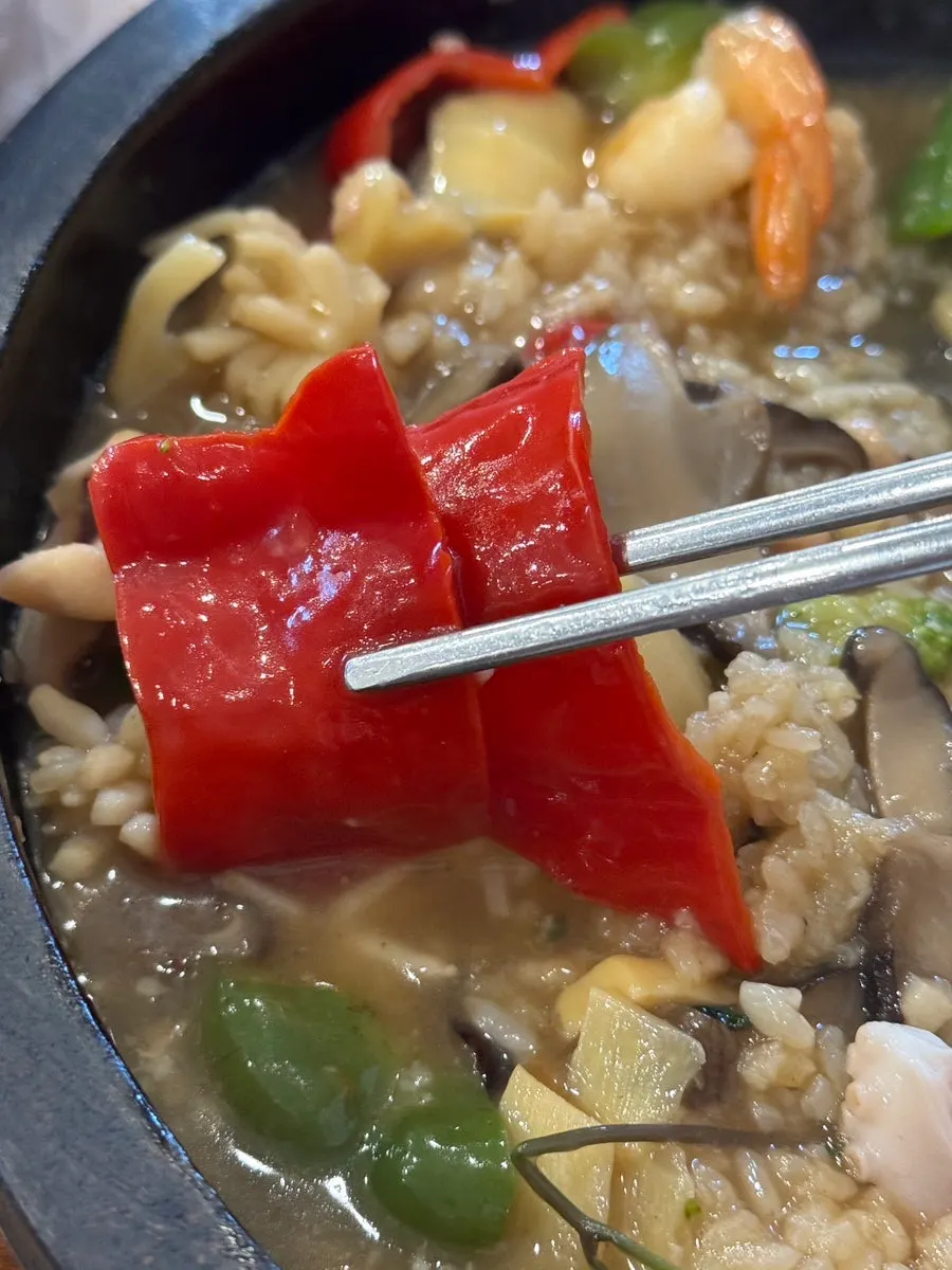 Chewy squid lifted out of the broth