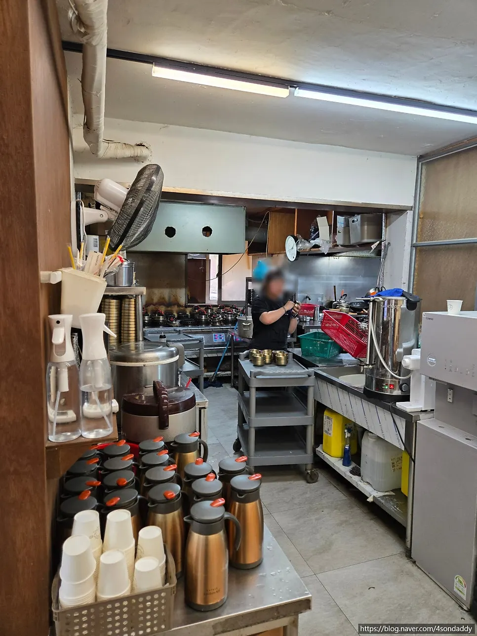 Kitchen with stone-pot rice cookers at Deulkkot Ssambap
