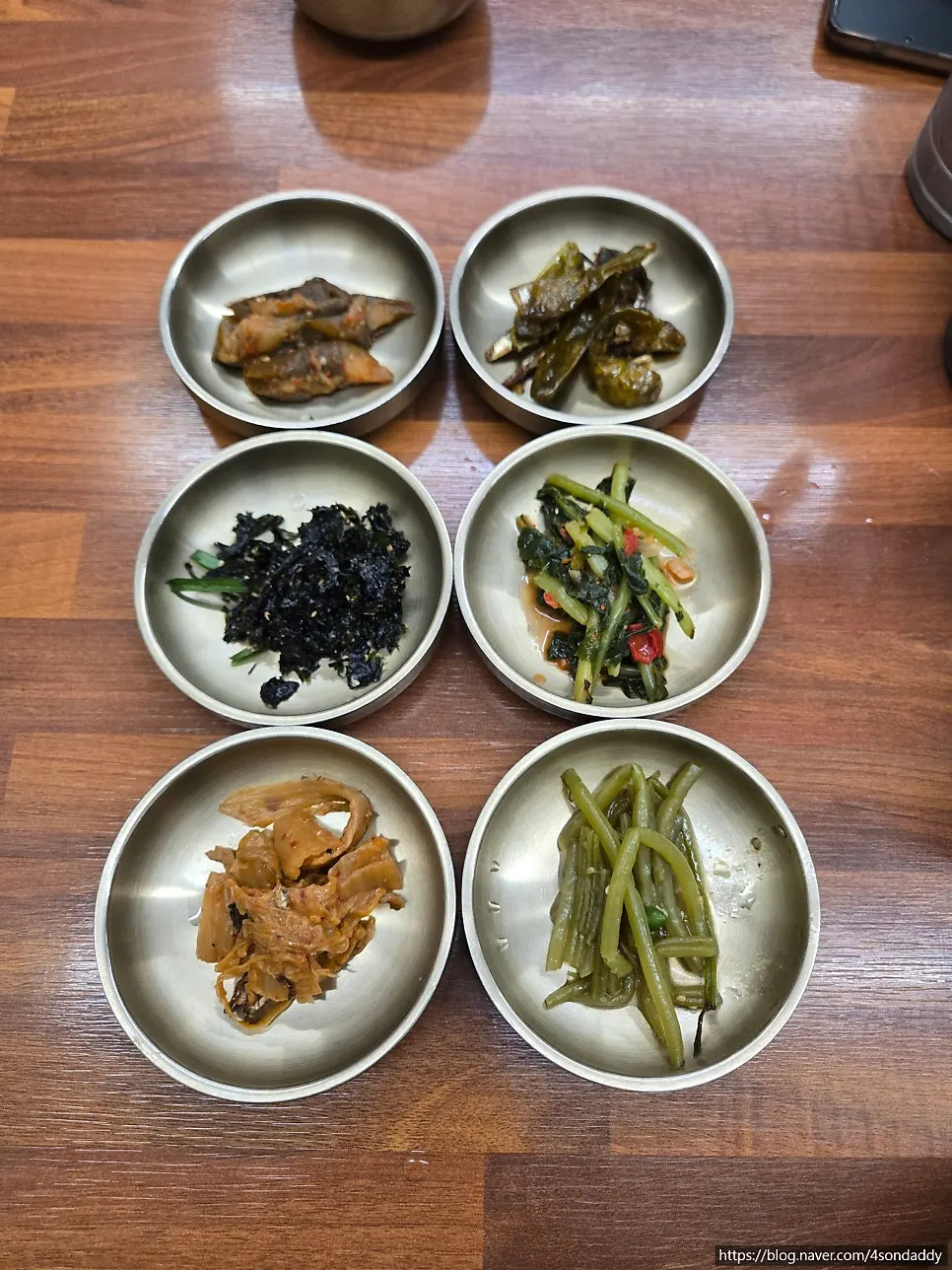 A plate of banchan with zucchini and eggplant