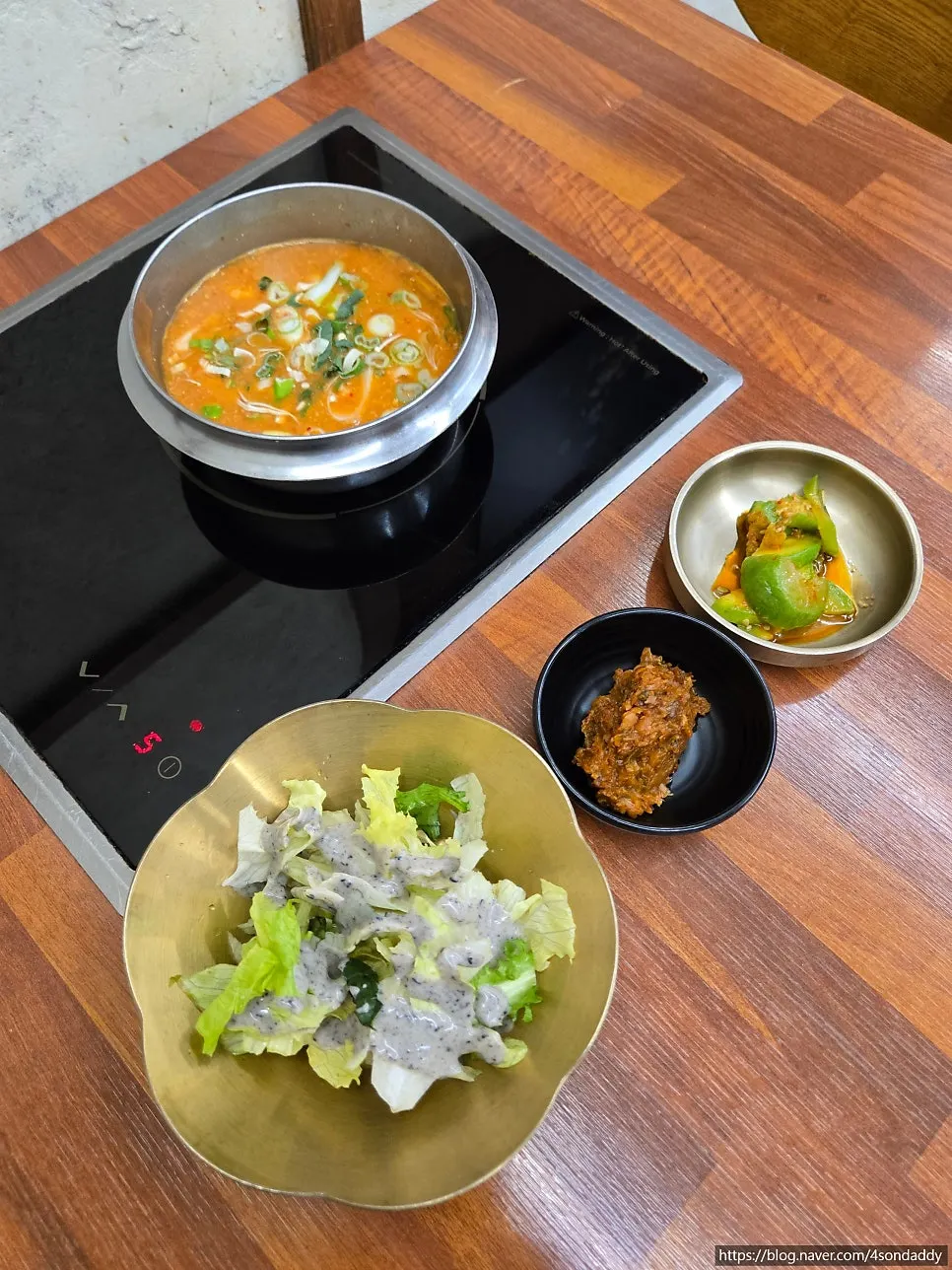 Side dishes of kimchi and braised peppers