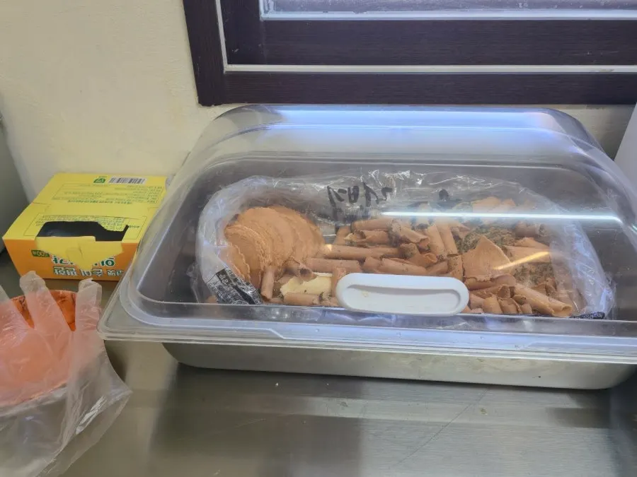 Self-serve banchan corner with rice crackers