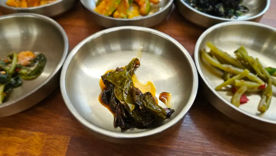 Plate of eggplant and other banchan at Deulkkot Ssambap