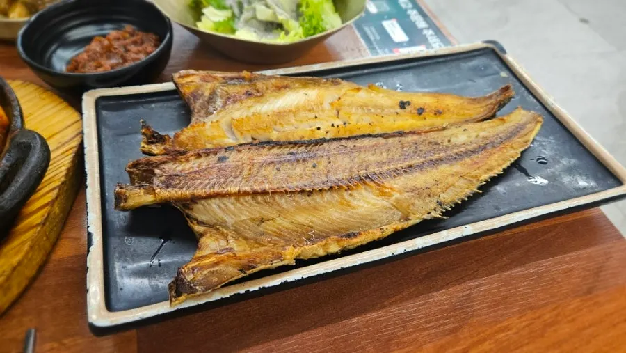 Plate of self-served wrap greens