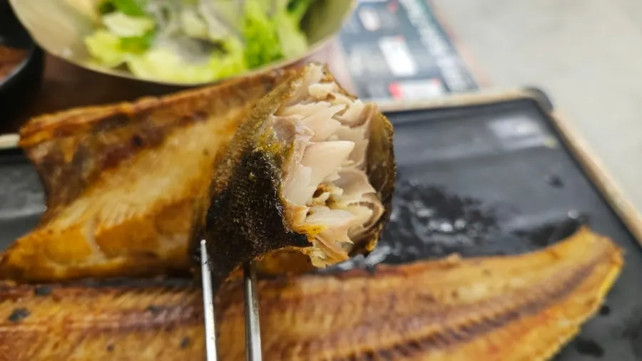 Golden-brown grilled atka mackerel