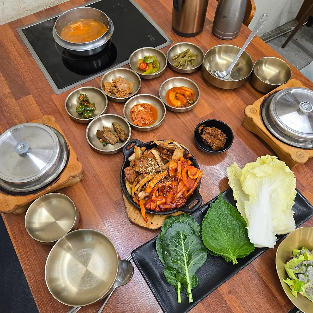 Main photo of a full ssambap table at Simhaksan Deulkkot Ssambap in Paju