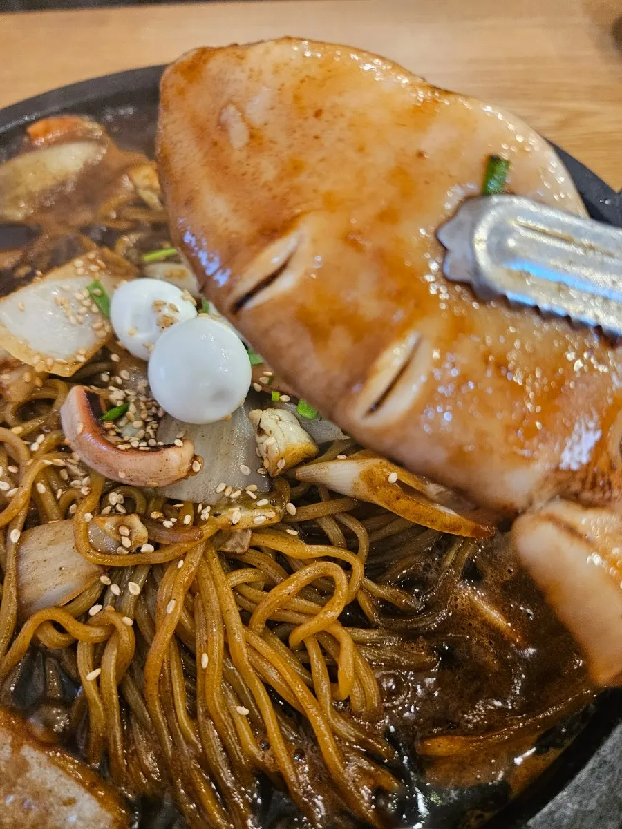 Chinese food set on a hot stone plate