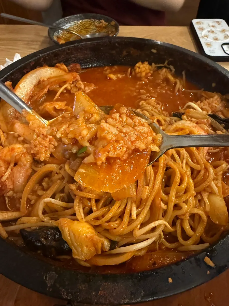 Scorched rice scraped off the stone plate with a spatula