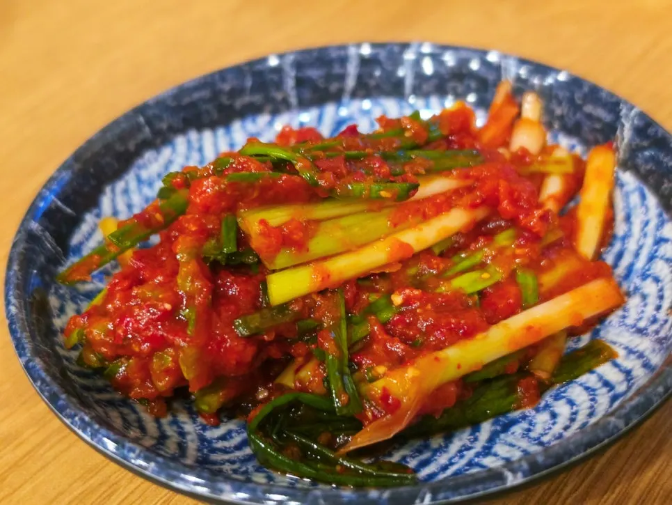 Table setting with pa kimchi, danmuji, and other side dishes