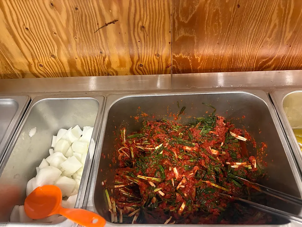Self-serve bar with danmuji, onion, and pa kimchi