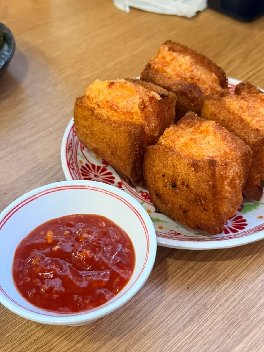 Cross-section of handmade tungbosha (4pcs) with sauce