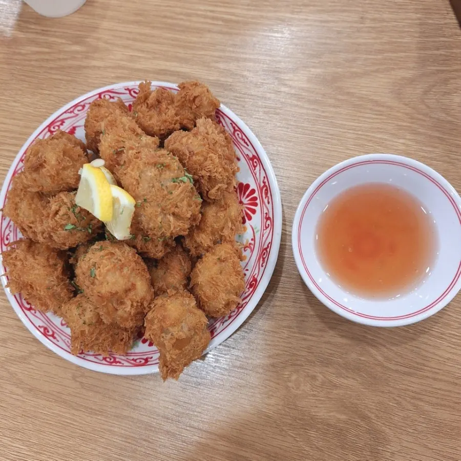 Stone-plate dish loaded with quail eggs and seafood