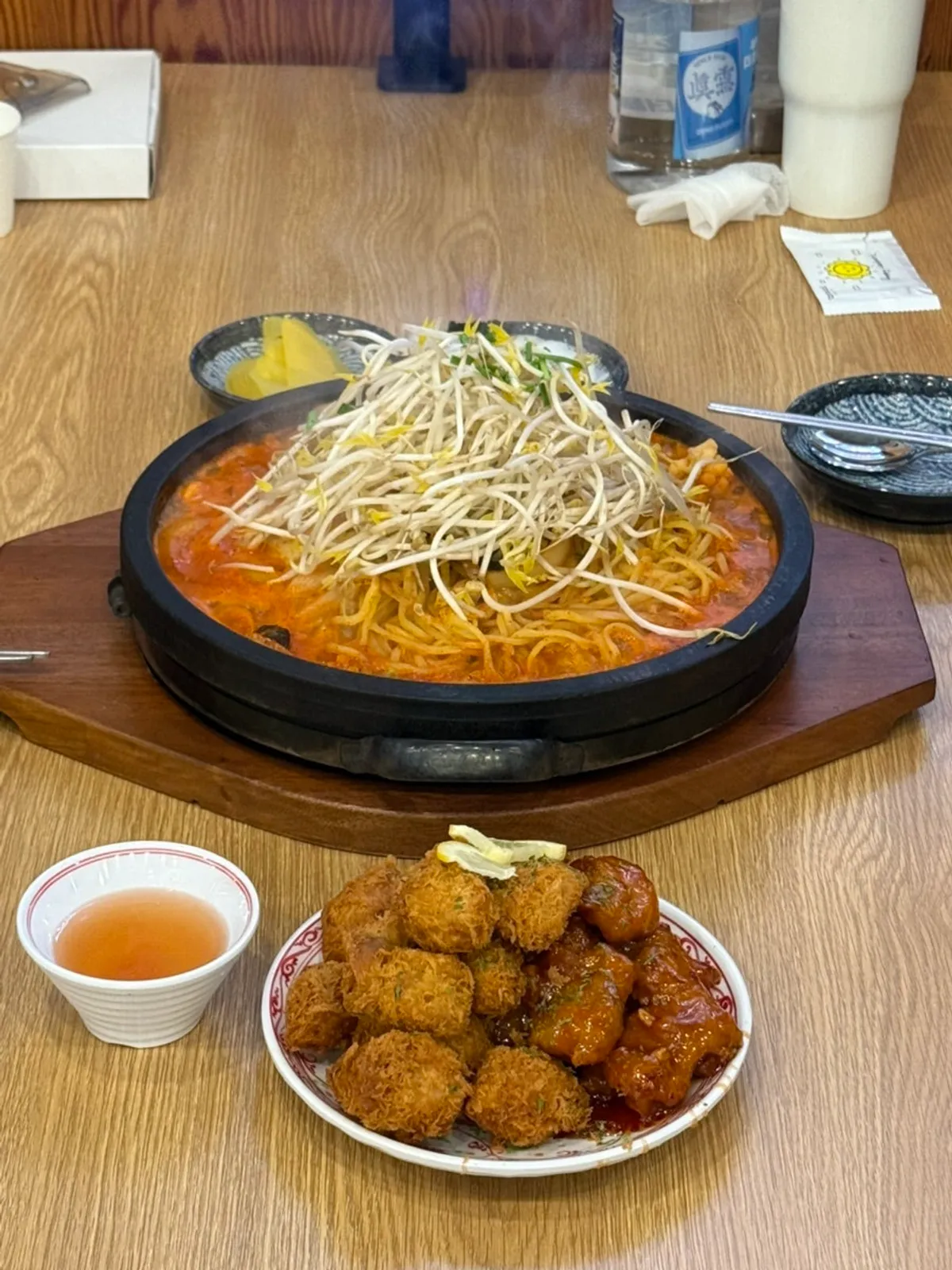 Stone-plate jjamppong topped with bean sprouts