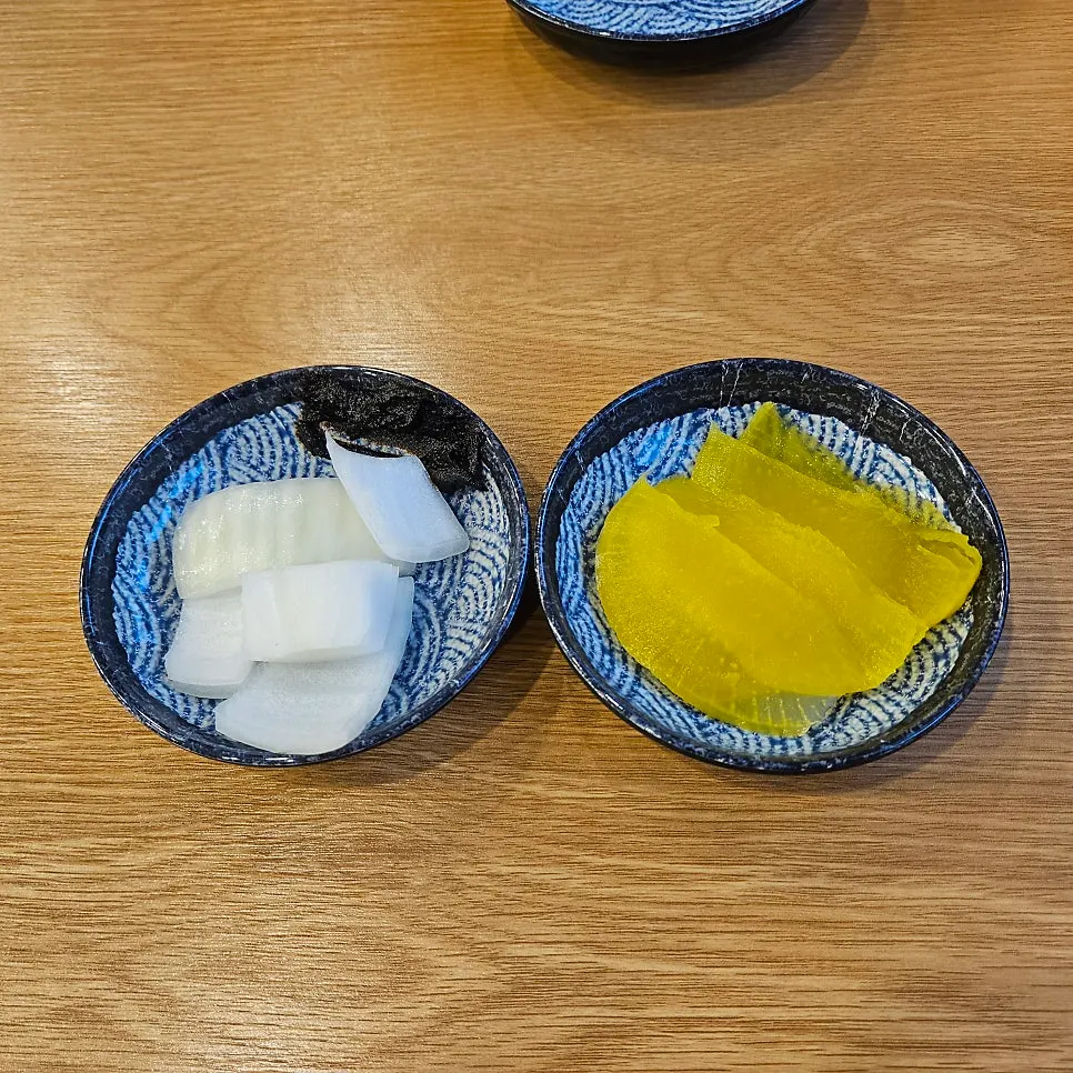 Basic sides of pickled radish, onion, and black bean paste