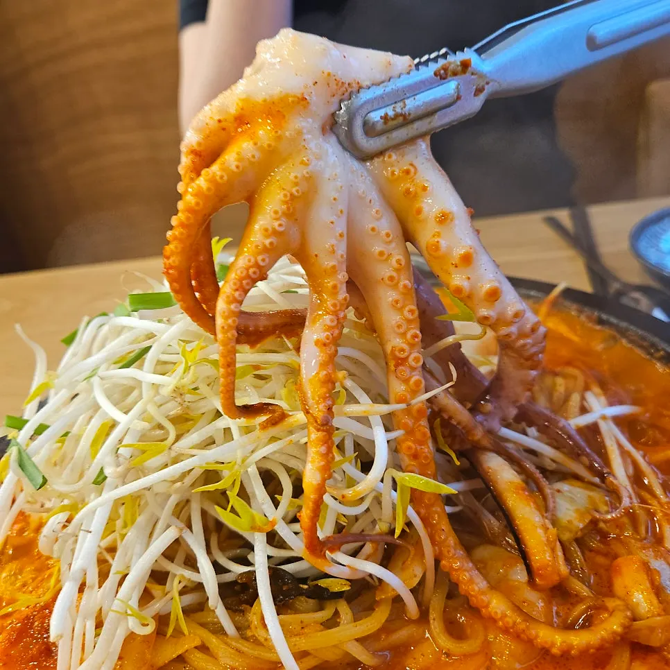Preparing stone-plate jjamppong after cutting the octopus