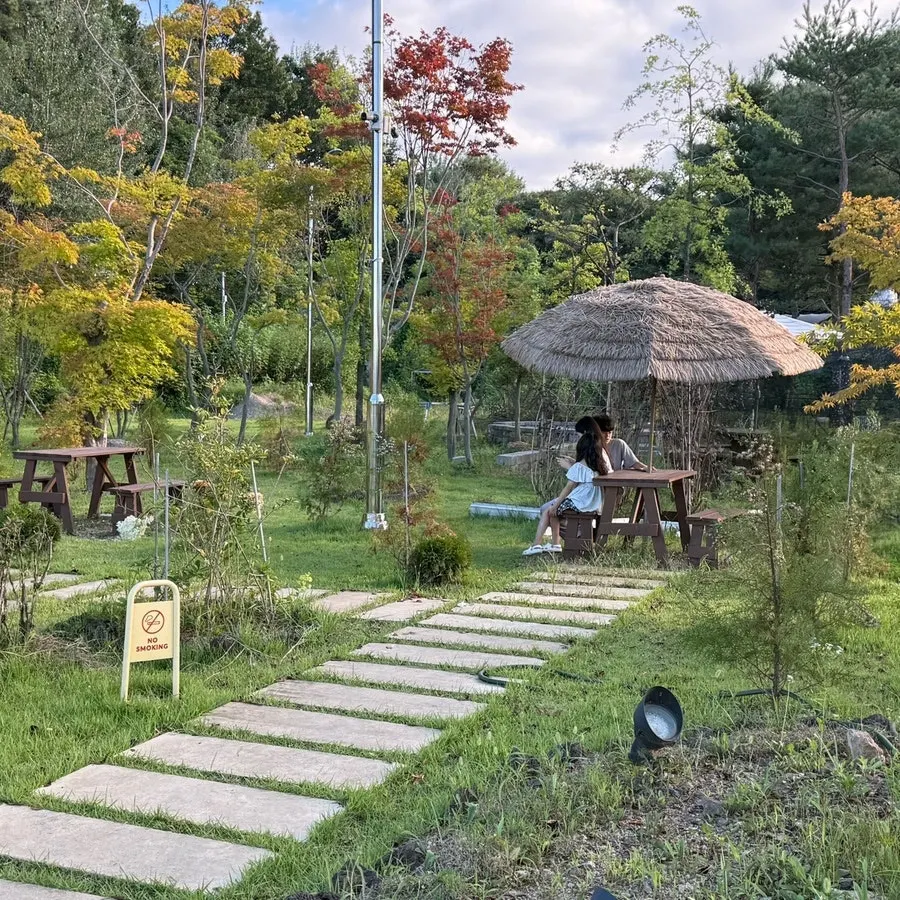 Outdoor garden with tables and parasols