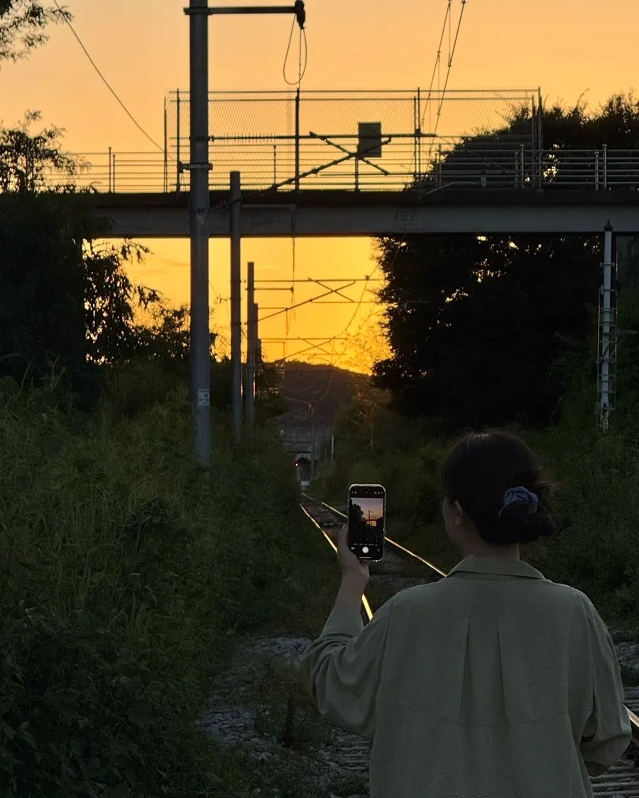 Railway beside the café glowing with sunset
