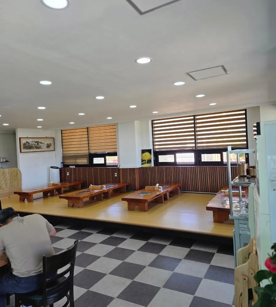 Interior of Cheonje Guksu with standing tables