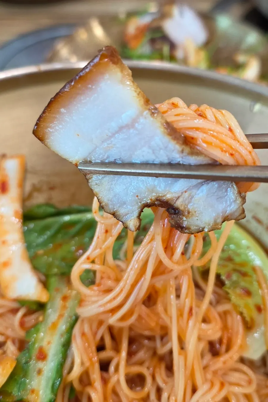 Bibim guksu noodles evenly coated in seasoning