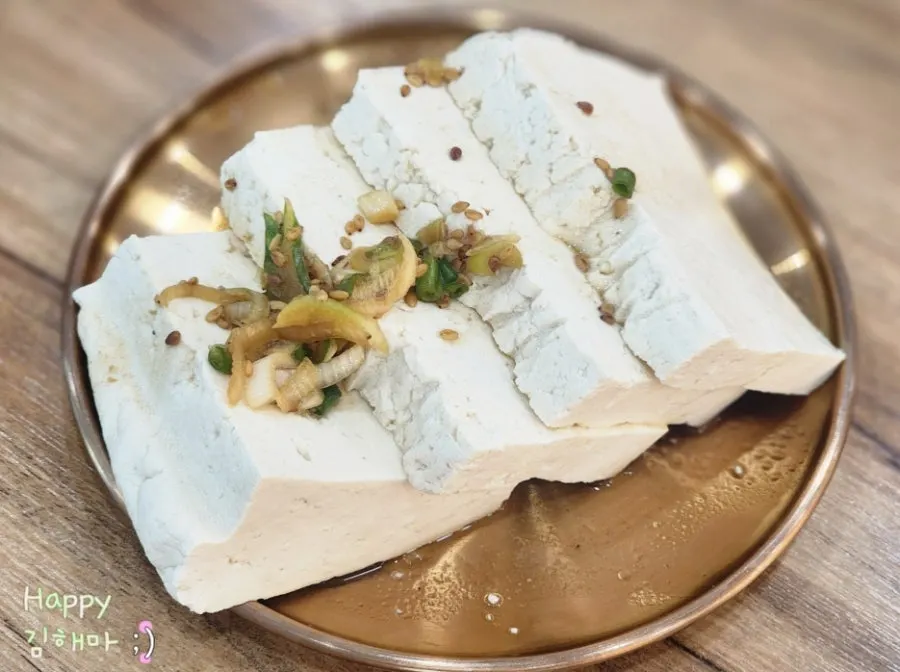 Cross-section of a torn-off piece of handmade tofu