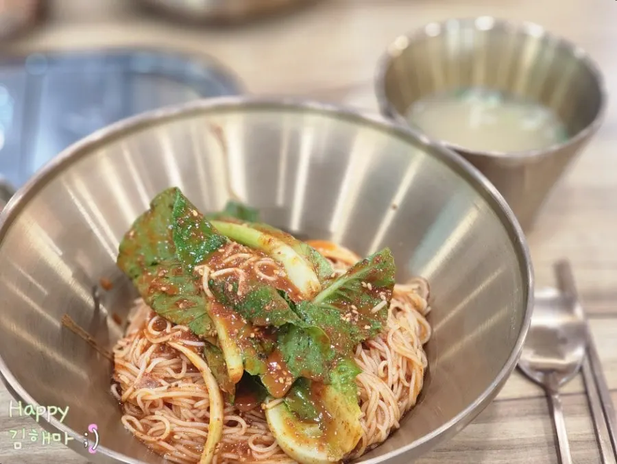 Bibim guksu topped with whole eolgali greens