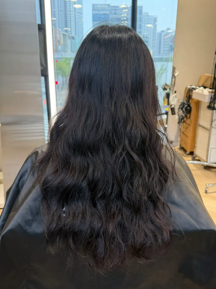Long hippie-perm hair before the treatment