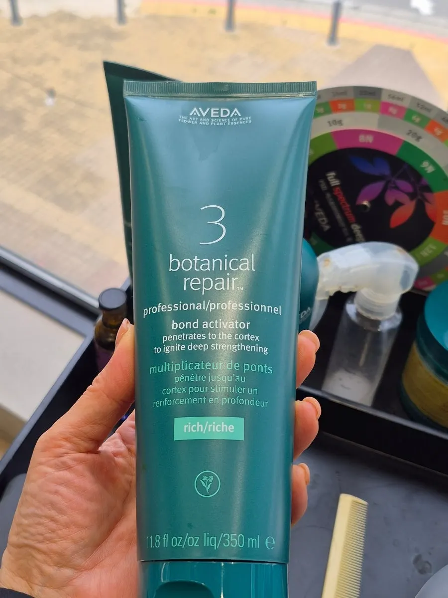 Close-up of the Aveda brand display shelf