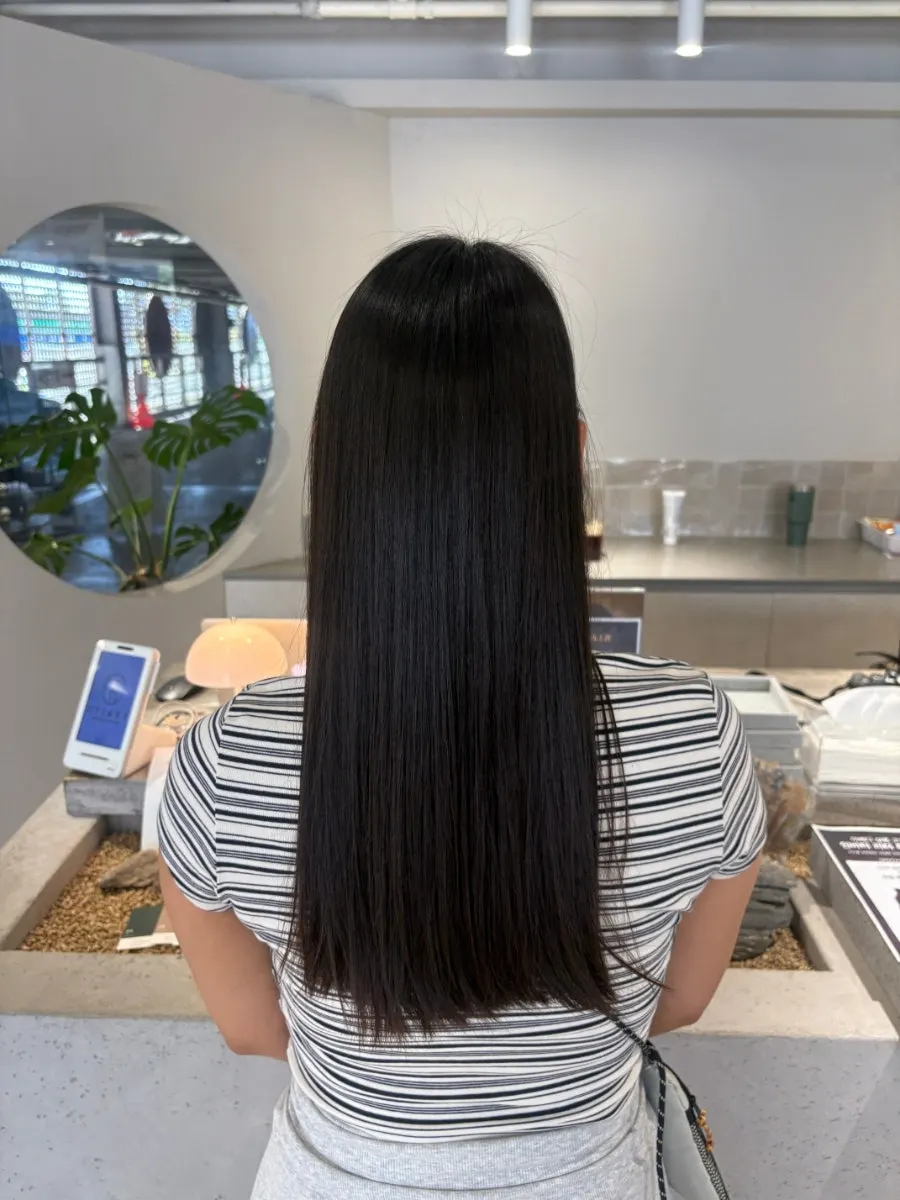 Neatly arranged long hair after the Aveda hair clinic treatment