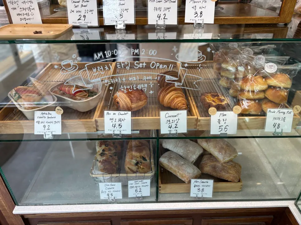 Boulangerie Tan showcase with fewer breads left by midday