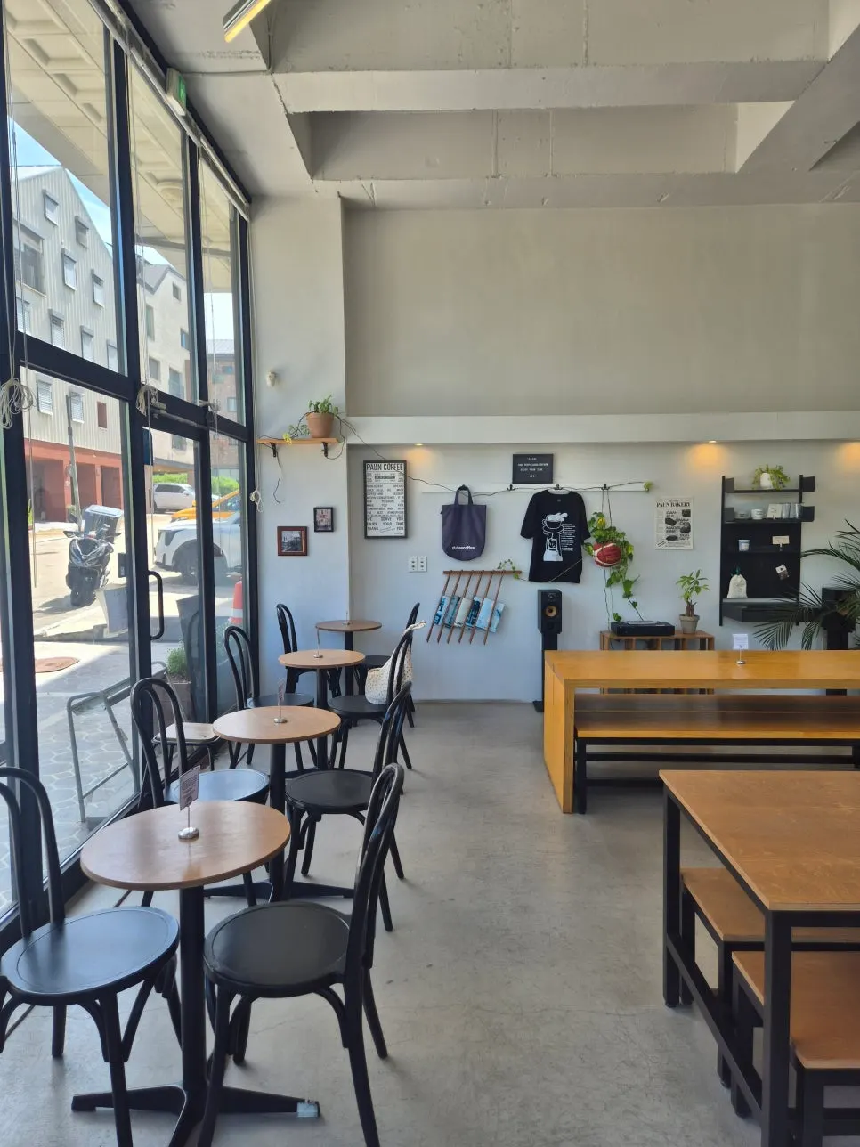 Interior of Pound Coffee lit by full glass windows