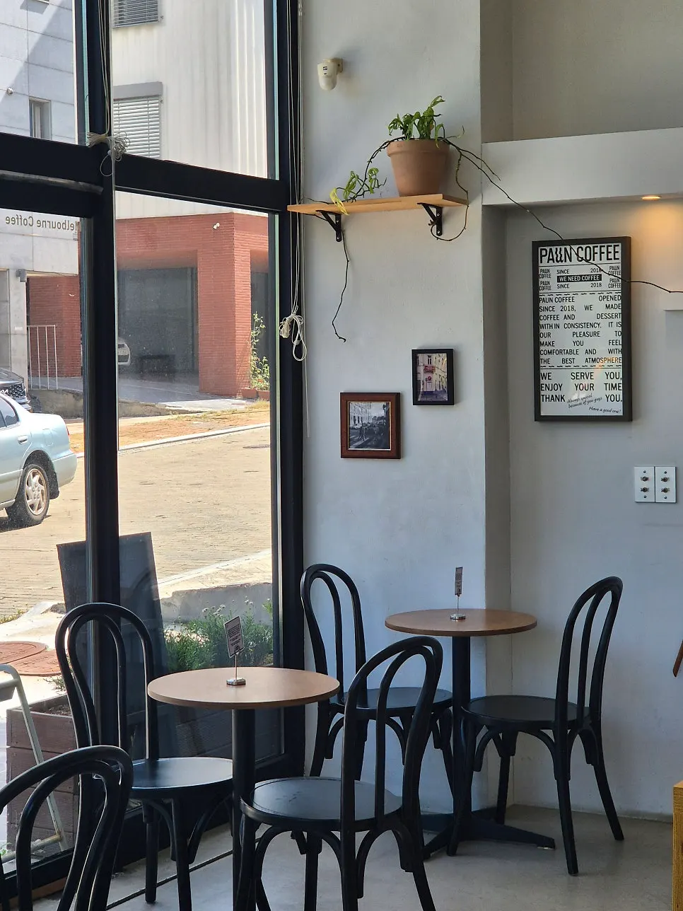 Window-side two-person table at Pound Coffee