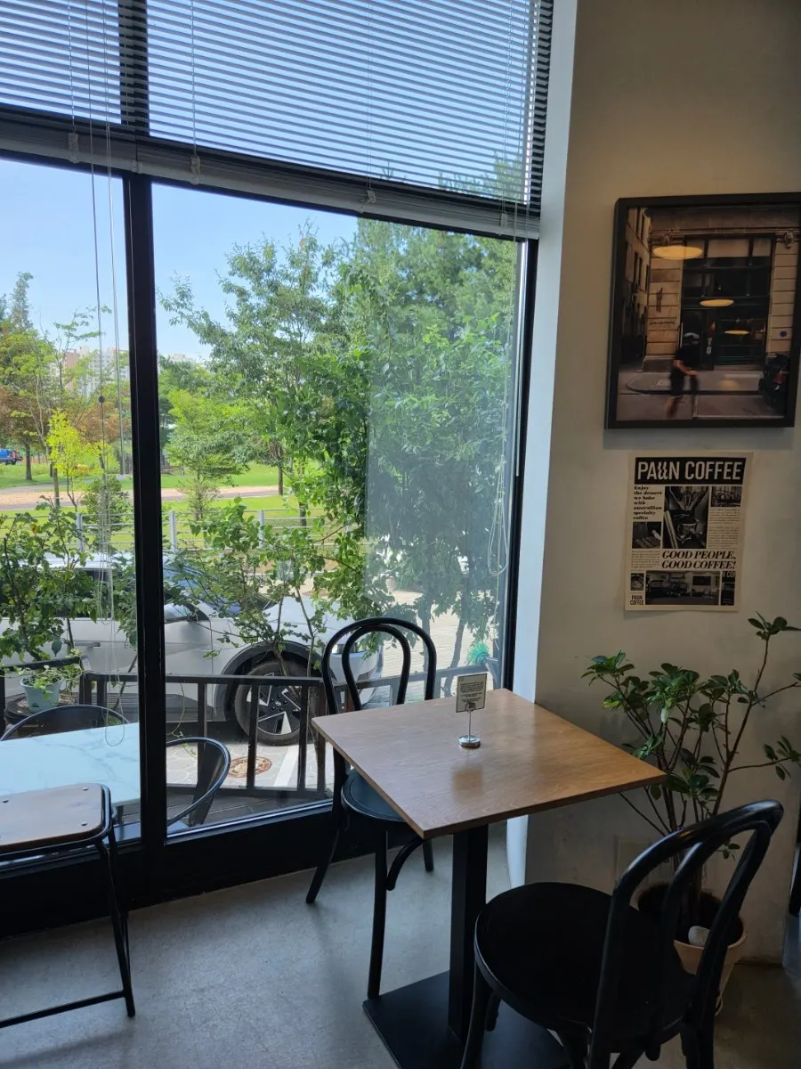Parking space in front of the café and the surrounding building