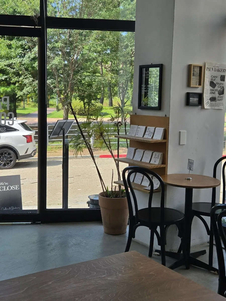 Café entrance located next to the park