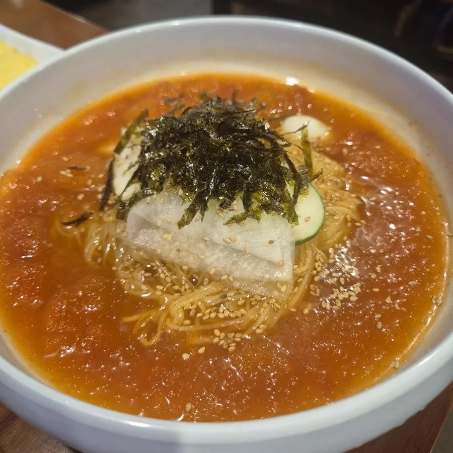 Spicy kimchi jjim paired with egg rolls