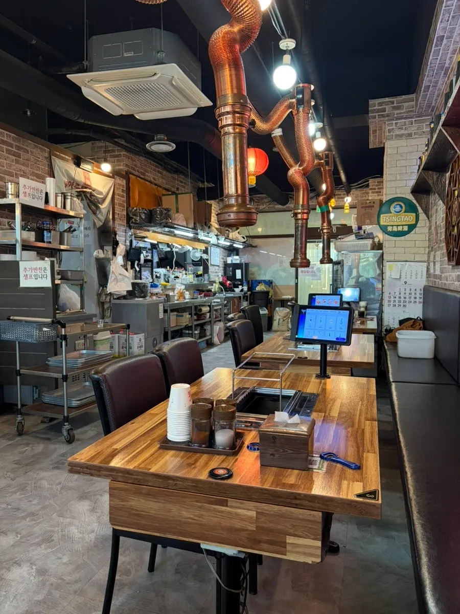 Section of the restaurant with a TV